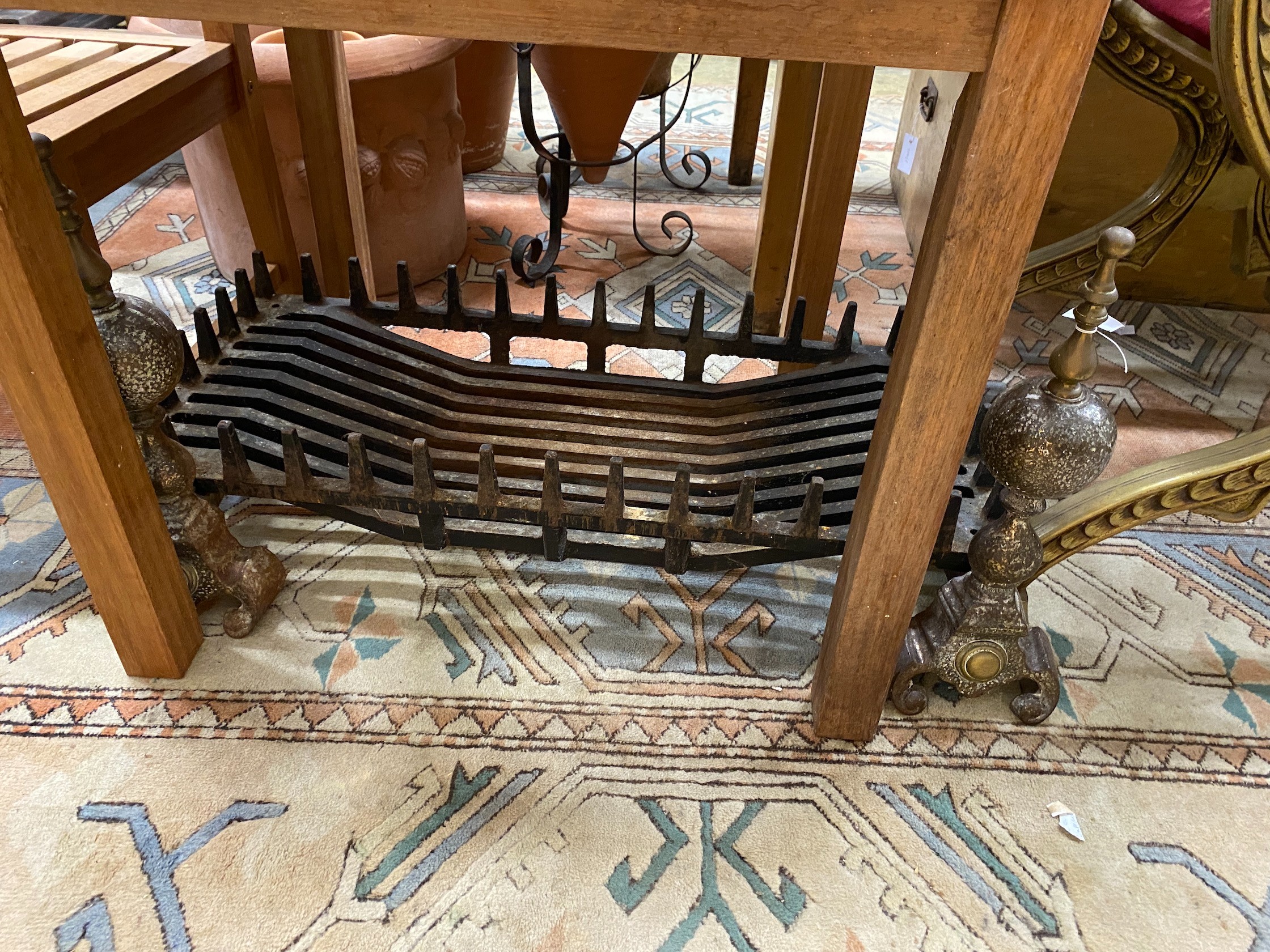 A wrought iron fire basket, width 91cm, depth 41cm and a pair of copper mounted fire dogs
